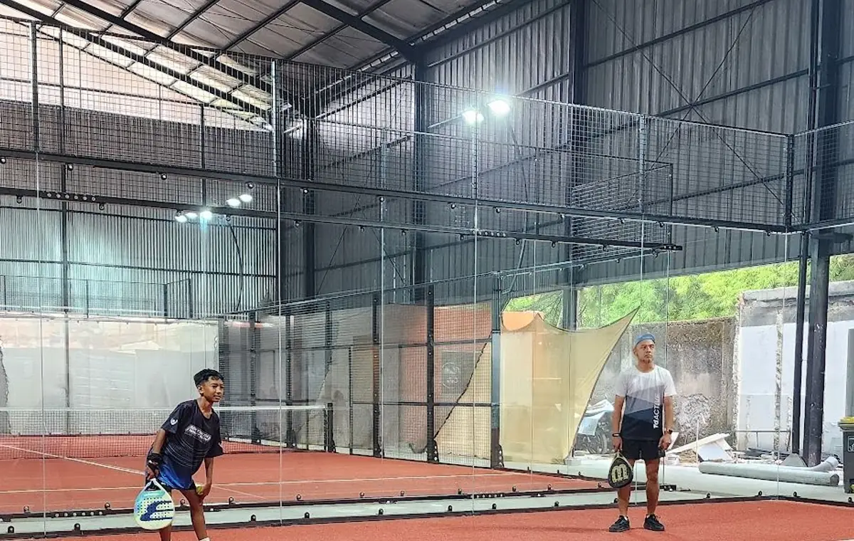 Players rallying on the clay-red courts at Filari Padel Lebak Bulus